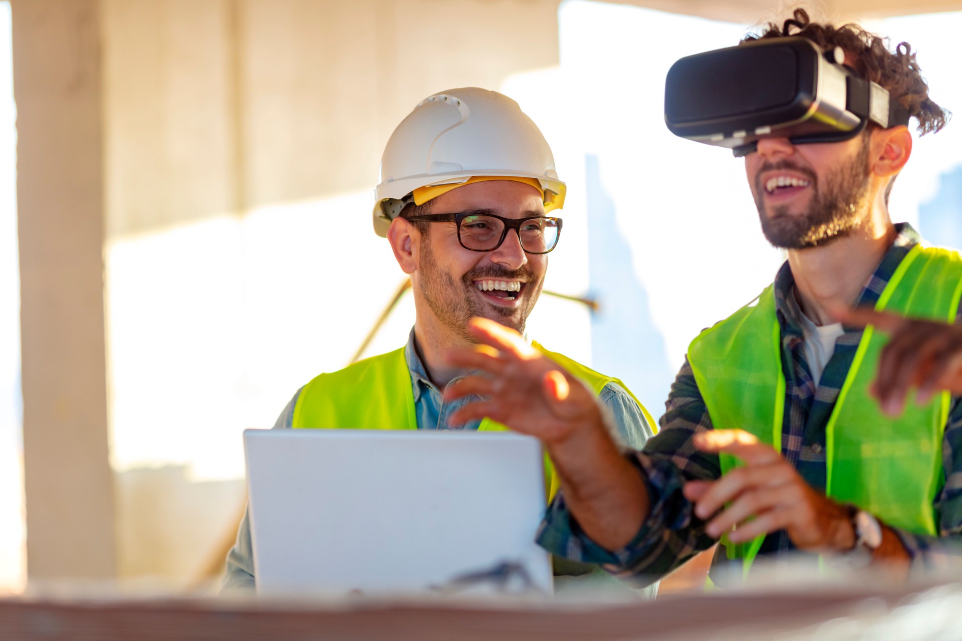 Two supervisors Using VR simulator for building visualization